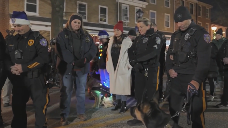 Members of the community who know crossing guard Bruce Morlack held a moment of silence for him during Saturday's holiday parade.