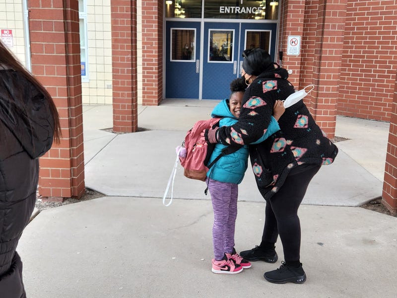 Big hug on first day back to school after strike