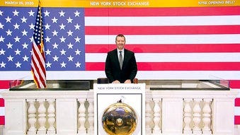 In this photo taken from video provided by the New York Stock Exchange, Director of Facilities & Building Operations James Katsarelis rings the opening bell at the NYSE, on Wednesday, March 25, 2020.  (New York Stock Exchange via AP)
