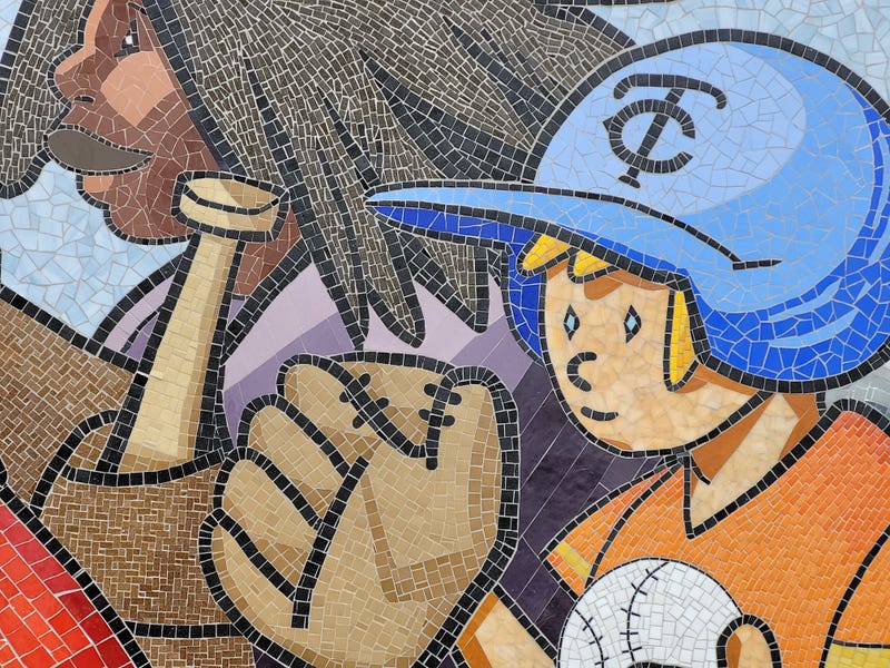 Pointing to the front of the mosaic, Bianchini said a boy holding a baseball was her favorite part of the piece. "I'm a mosaic artist. The ball is perfect. It's the perfection of the tile that brings me joy."