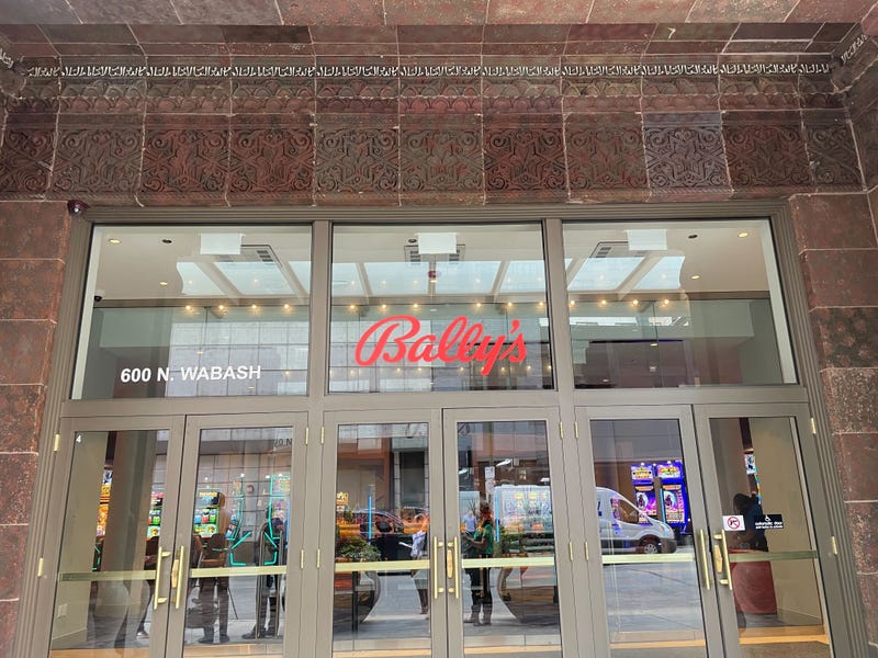 entrance to casino glass doors and Ballys logo