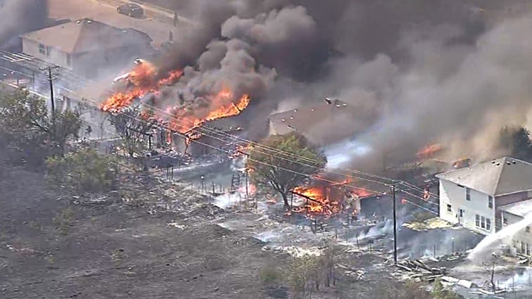Balch Springs fire ignited when a grass mower blade hit a rock, causing a spark