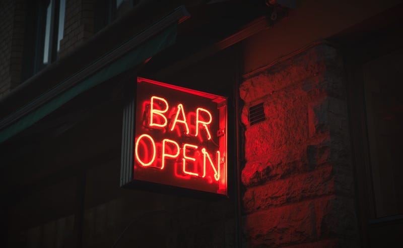 neon sign saying 'Bar Open'
