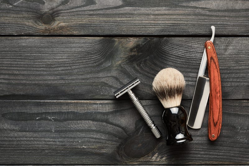 Vintage barber shop tools on old wooden background