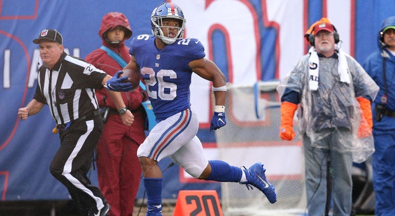 Giants running back Saquon Barkley runs for a touchdown against the Jacksonville Jaguars on Sept. 9, 2018, at MetLife Stadium.