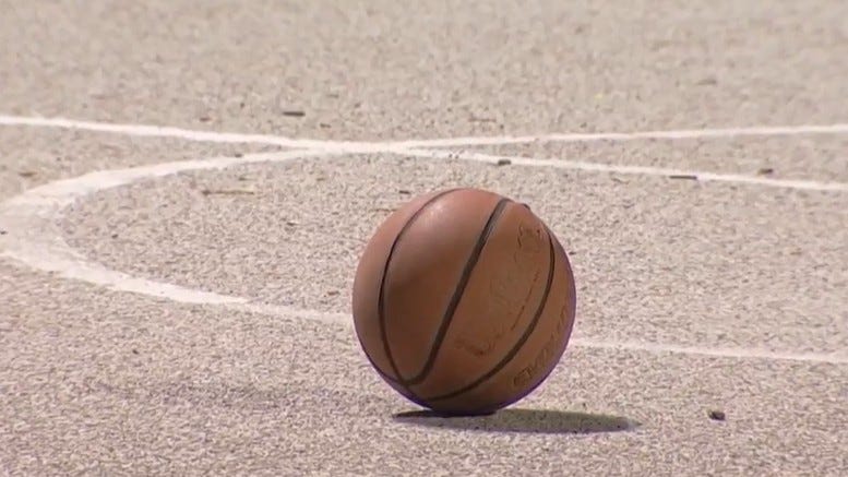 A basketball on the Center City court where a teen was shot Friday evening