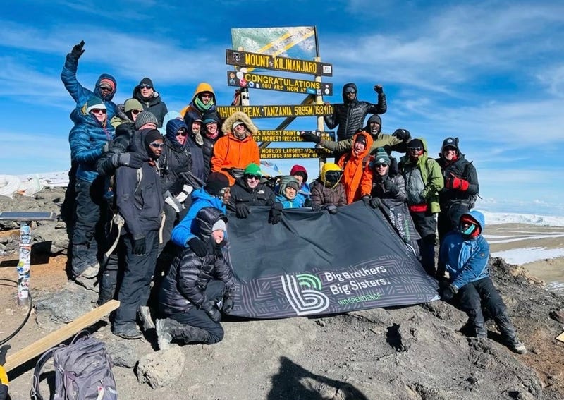 19 mentors from Big Brothers Big Sisters Independence celebrating at the top of Mount Kilimanjaro in Tanzania.