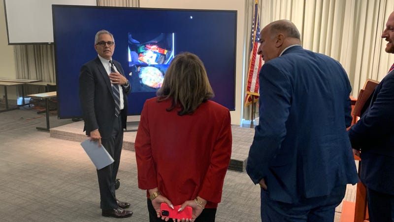 District Attorney Larry Krasner shows photos of the evidence to City Council members from the Kensington caucus: Quetcy Lozada, Mark Squilla and Jim Harrity.
