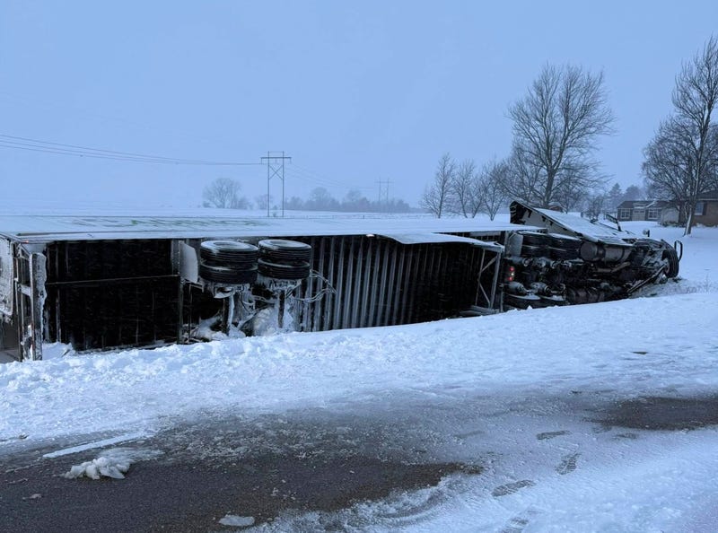Semi hauling pinto beans overturns.