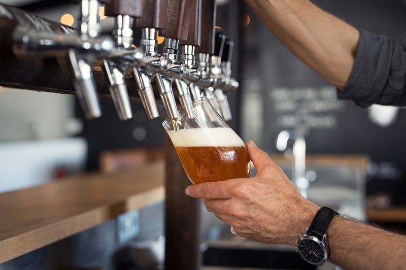 A draft beer pouring from a tap