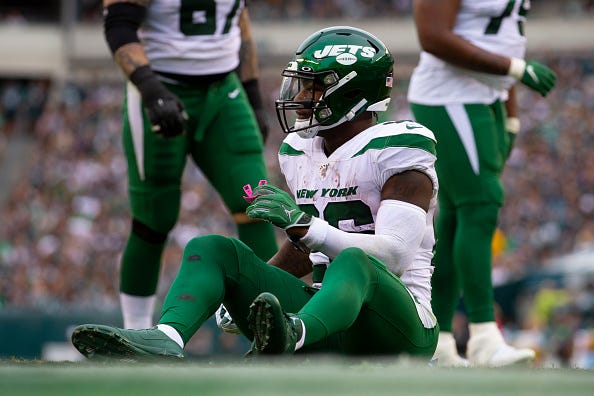 Jets RB Le'Veon Bell sits on the ground during a game against the Eagles. 
