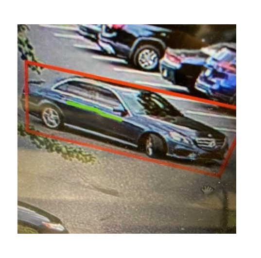 She fled in a black Mercedes sedan.