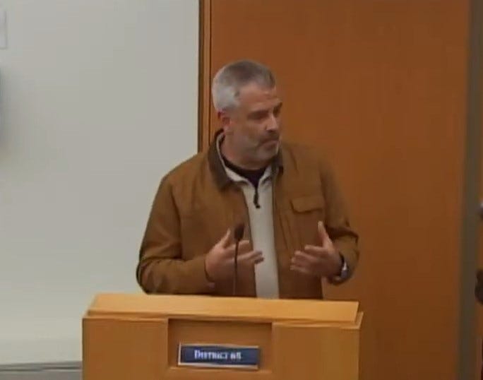 resident speaking at school board meeting