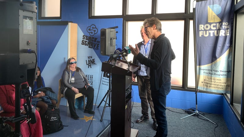 Actor and musician Kevin Bacon, whose nonprofit contributed to significantly to the project, addresses the gathering on Wednesday.