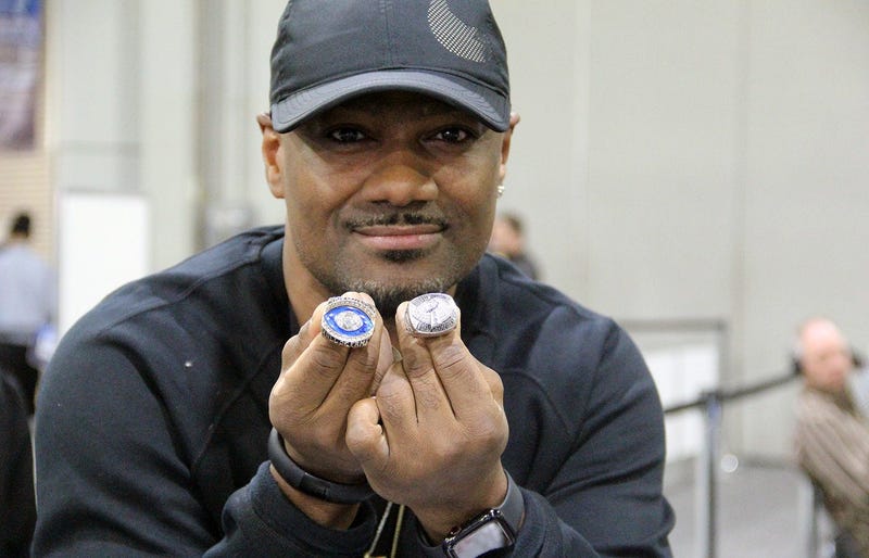 Big Tigger holding Warren Sapp's championship rings