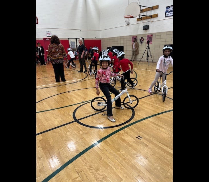 child riding bicycle