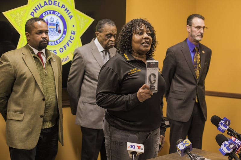 Philadelphia Sheriff Rochelle Bilal (front center), along with state Sen. Sharif Street (left), Rev. Robert Collier of the Philadelphia Black Clergy (rear center) and Councilmember Jim Harrity (right), urges Philadelphians to celebrate New Year's Eve safely, without firing guns.