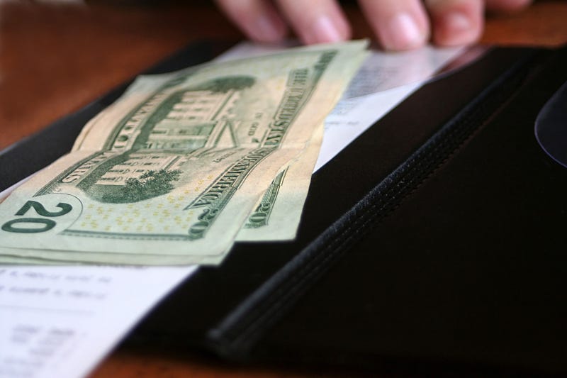 Bill with cash paid at restaurant