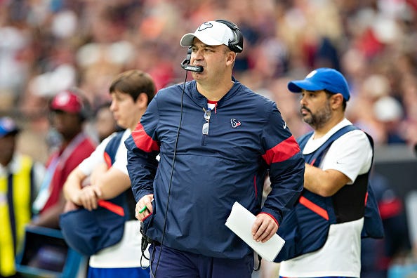 Bill O'Brien stares across the field from the Texans sideline. 