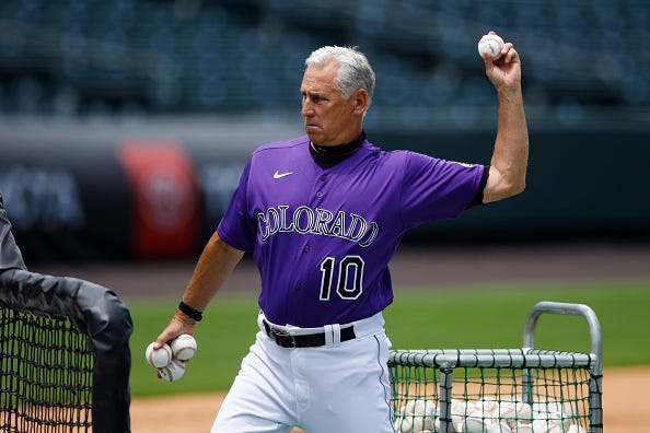 Rockies manager Bud Black tosses batting practice. 