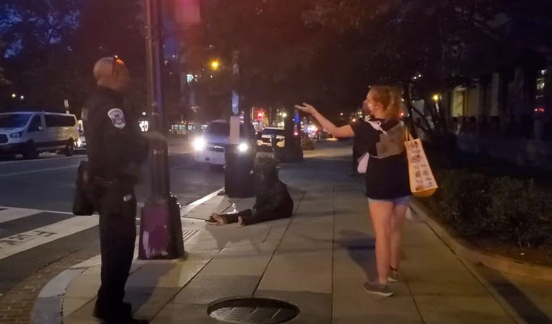 Black officer talks to white protester