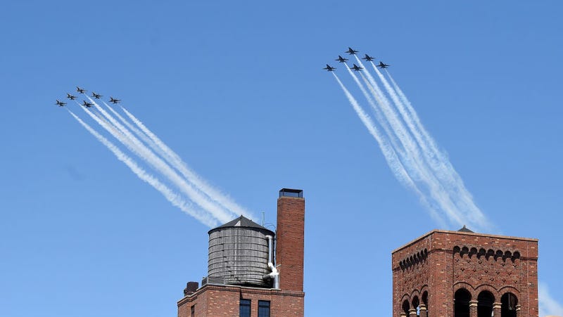 Jets from the Navy Blue Angels and Air Force Thunderbirds fly in formation over NYC