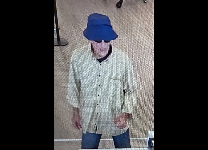 A still taken from newly released security camera images show a man believed to be behind two Chicago bank robberies. Authorities said he wore the same blue bucket hat in both robberies.