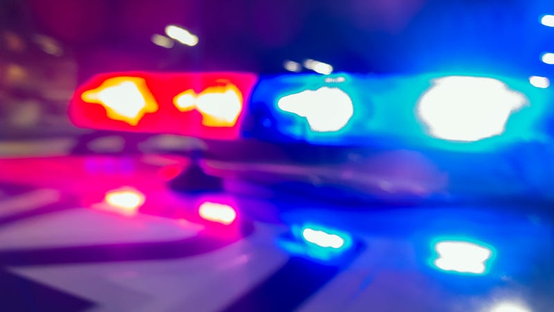 Police car lights in night time, crime scene, night patrolling the city. Abstract blurry image.