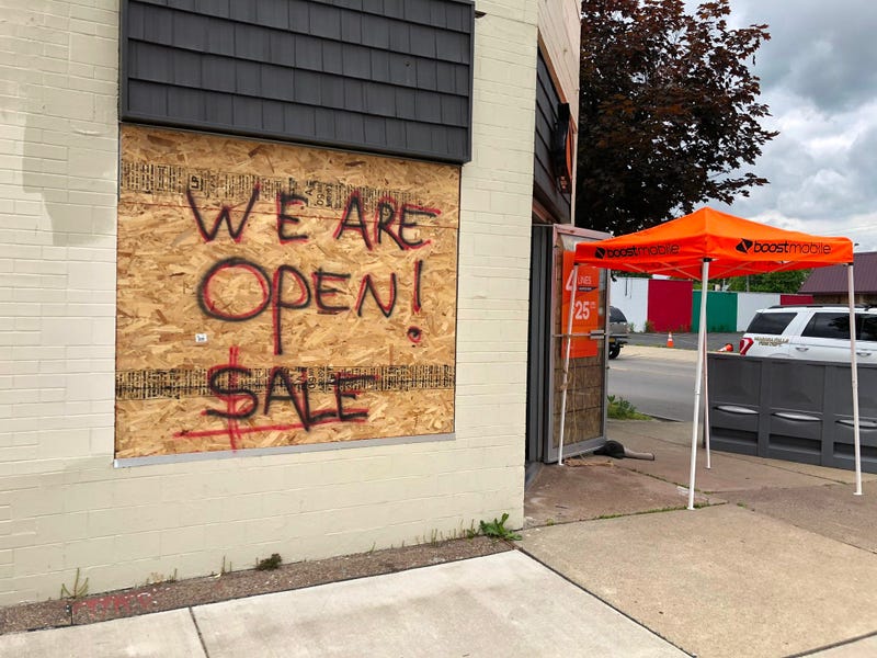 Boost Mobile on Pine Avenue in Niagara Falls is open despite plywood on its windows. June 11, 2020 (WBEN Photo/Mike Baggerman)