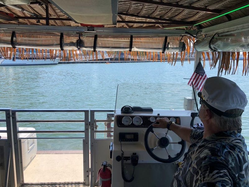 A maritime pilot on the Big Kahuna drives the boat along the Buffalo River. July 9, 2020 (WBEN Photo/Mike Baggerman)