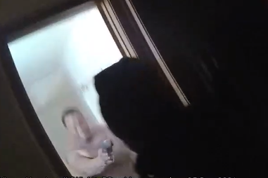 Body cam image of suspect pointing handgun at WPD officers