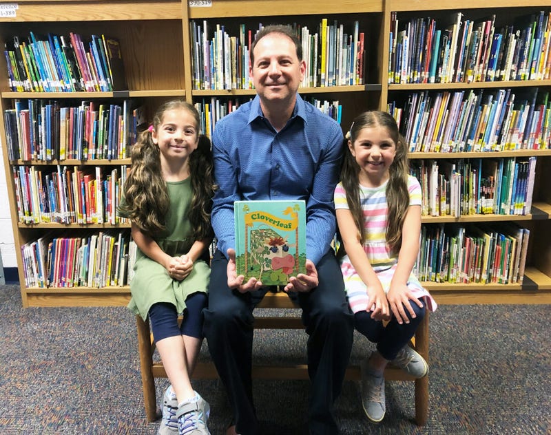 Pier Fazzalari with his two daughters and the infamous book