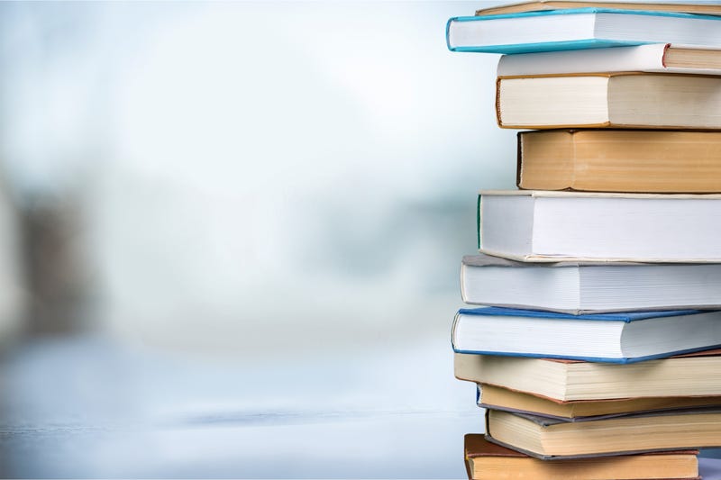 Books collection in pile on background