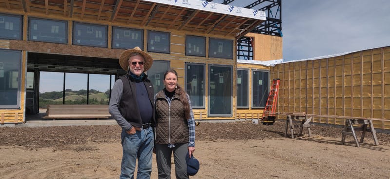 Howard and Merritt Booster stand in front of their new home being built in Santa Rosa where their previous house was destroyed by the 2017 Tubbs Fire.