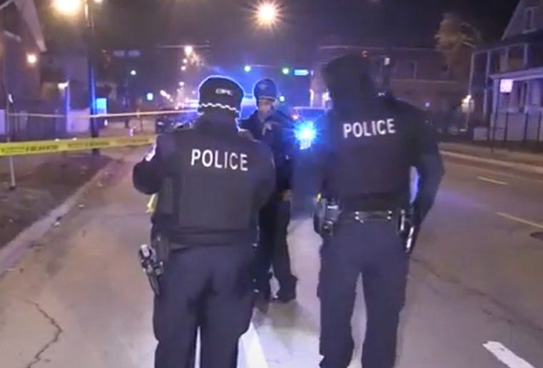 Police Officers investigate crime scene