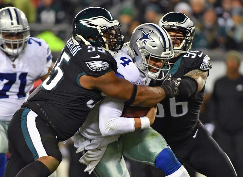 Philadelphia Eagles defensive end Brandon Graham (55) and defensive end Chris Long (56) sack Dallas Cowboys quarterback Dak Prescott (4) during the second quarter at Lincoln Financial Field.