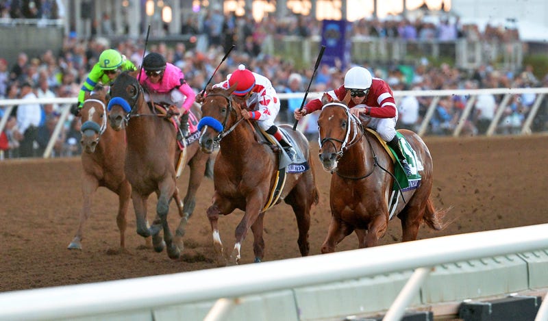 Nov 4, 2017; Del Mar, CA, USA; Gunner Runner (right) leads Collected (middle right) and West Coast (middle left) and War Story (left) to the finish line for the win in the 12th race during the 34th Breeders Cup. Jake Roth-USA TODAY Sports