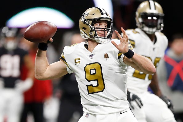 Saints QB Drew Brees looks for a receiver downfield. 