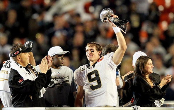 Drew Brees celebrates winning a Super Bowl with the Saints.