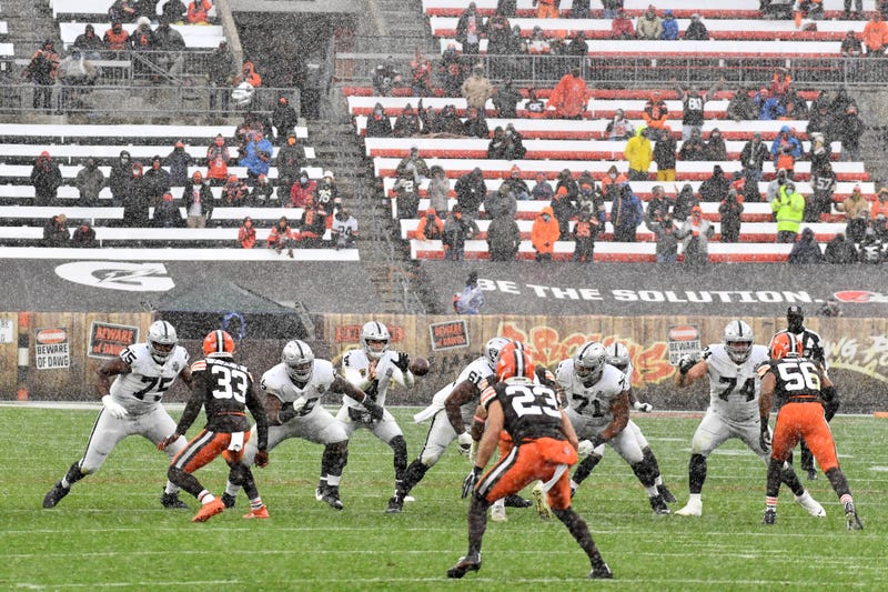 Las Vegas Raiders quarterback Derek Carr takes a snap during the first half against the Cleveland Browns at FirstEnergy Stadium.