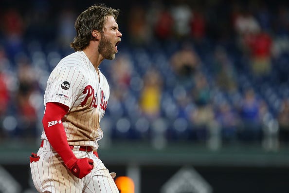 Bryce Harper celebrates a home run with the Phillies. 