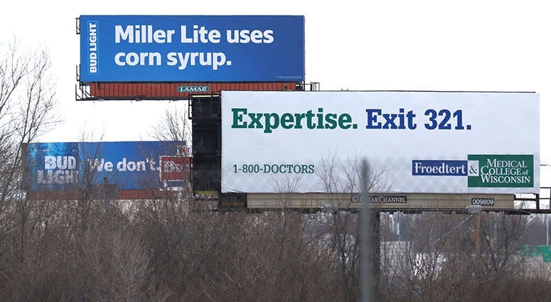 Bud Light billboard claiming Miller Lite uses corn syrup