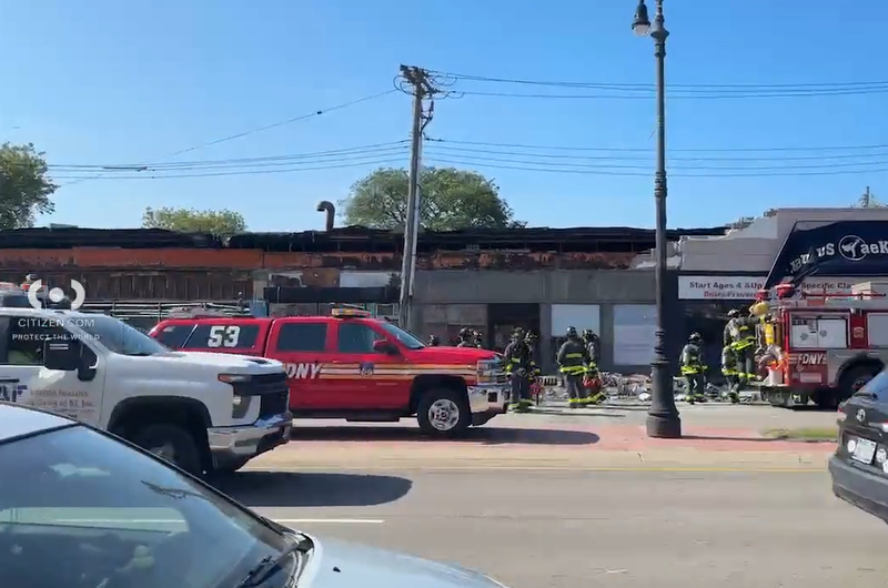 The signage on a Queens furniture store collapsed on Wednesday, injuring an adult and two children.