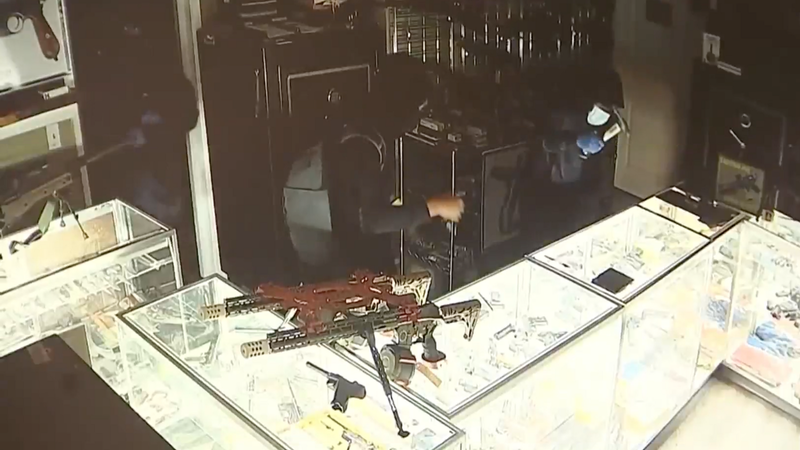 Teens are caught on surveillance video smashing the glass case at a gun shop in Bucks County on May 30, 2023.