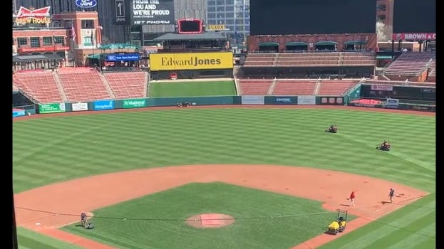 MOWING THE ARCH: St. Louis' landmark is back as lawn art on newly placed sod at Busch Stadium