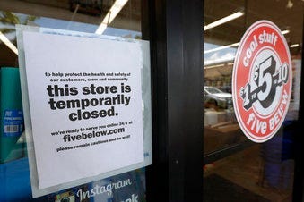 FILE - In this April 23, 2020 file photo, a sign is posted on a closed store in North Miami, Fla.  (AP Photo/Wilfredo Lee, File)