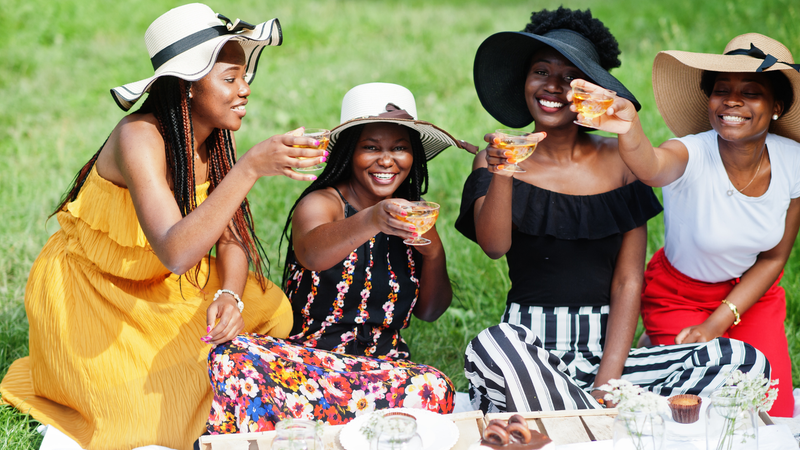 Black women celebrating outdoors