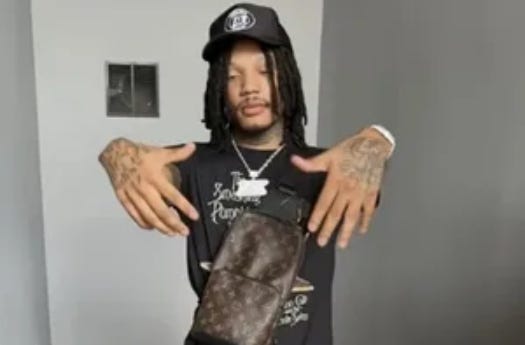 Malik Taylor, known by his stage name 24Lik, is a 24-year-old member of the Cashgang violent street gang who attempted to enter Truth Gentleman's Club around 1 a.m. Sunday with a loaded, illegal firearm