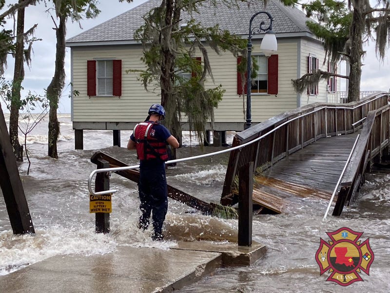 first responder during rescue at waterfront cabins