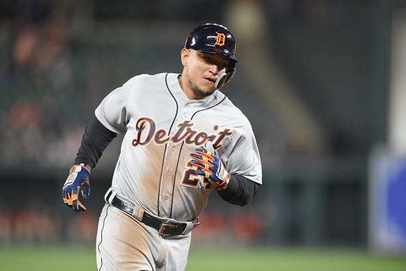 Miguel Cabrera trots around the bases after slamming a home run. 
